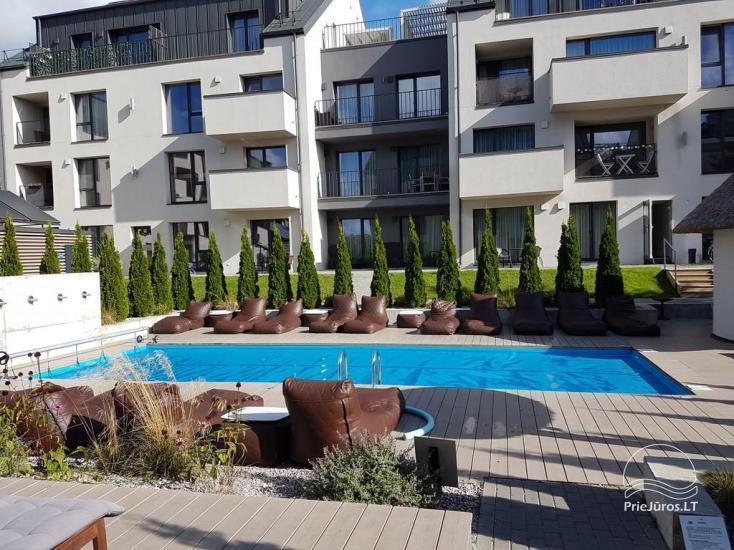 Palangos centre Malūno vilose, dviejų kambarių apartamentas